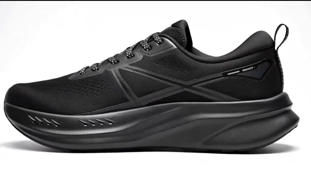 All-black athletic sneaker, sleek modern design.