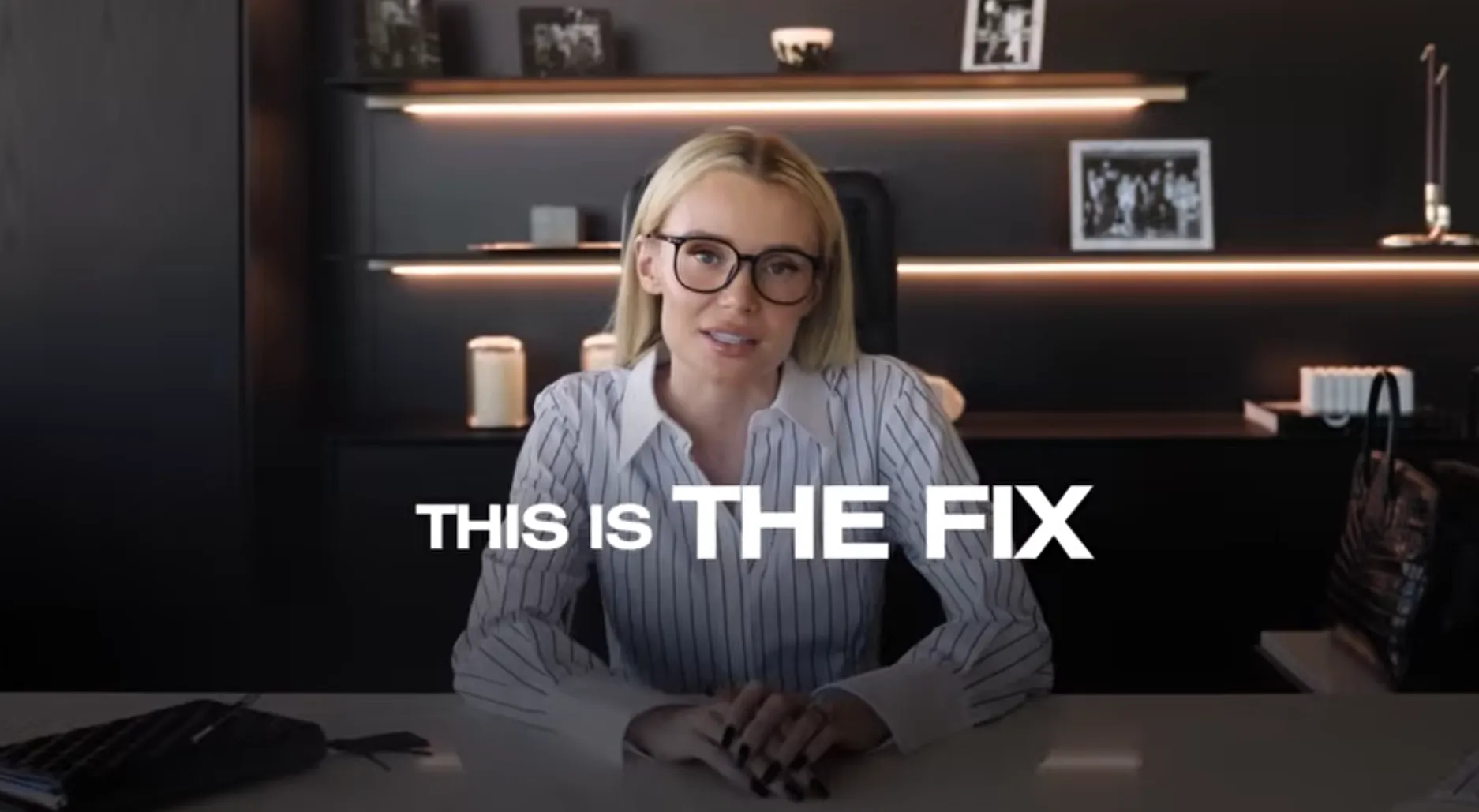 A woman in an office setting presents a message about a solution.